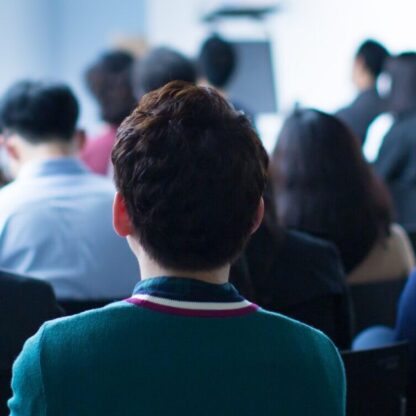 Presenter Presenting on Stage at Conference Meeting.