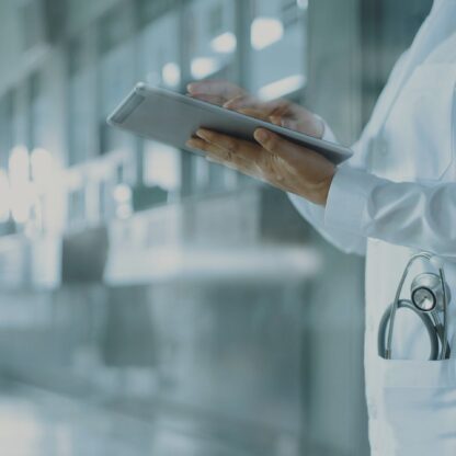Healthcare and medicine. Medical and technology. Doctor working on digital tablet on hospital background